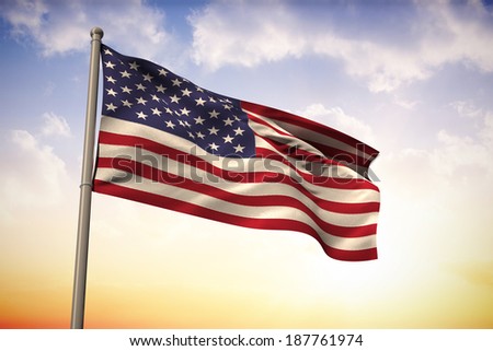 USA national flag against beautiful orange and blue sky