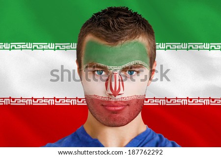 Composite image of serious young iran fan with facepaint against digitally generated iran national flag