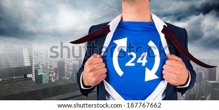 Businessman opening his shirt superhero style against balcony overlooking city