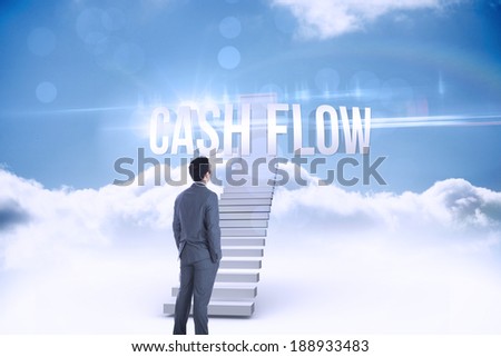 The word cash flow and businessman standing against shut door at top of stairs in the sky