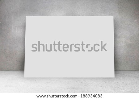 Composite image of white card against grey room