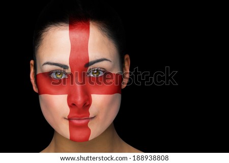 Composite image of england football fan in face paint against black