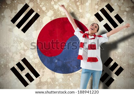 Excited asian football fan cheering against south korea flag