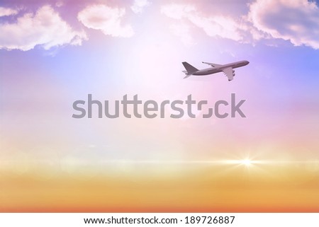 Graphic airplane flying over beautiful orange and blue sky