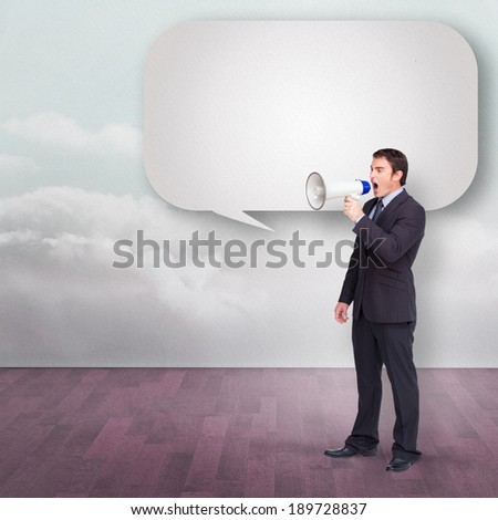 Standing businessman shouting through a megaphone with speech bubble against clouds in a room