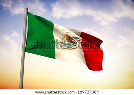 Mexico national flag against beautiful orange and blue sky