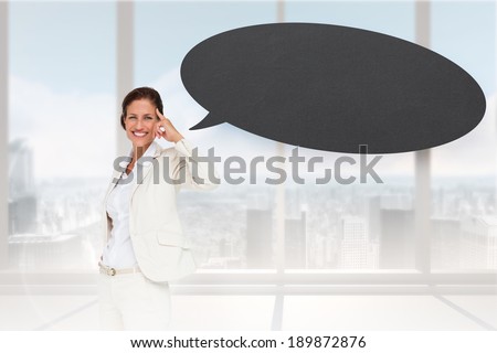 Thinking businesswoman with speech bubble against bright white room with windows