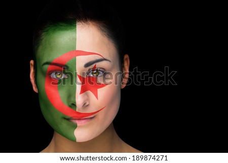 Composite image of iran football fan in face paint against black
