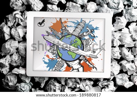 Global tourism concept on paint splashes on digital tablet on crumpled paper