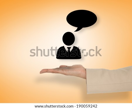 Female hand presenting man speaking against orange vignette