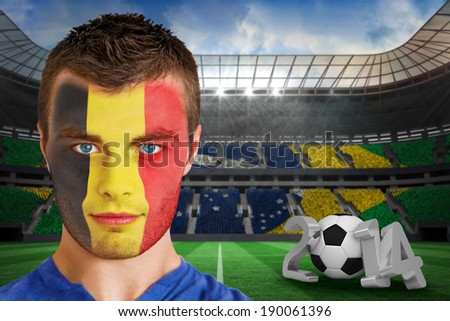 Composite image of serious young belgium fan with face paint against large football stadium with brasilian fans