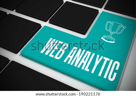 The word web analytic and winners cup on black keyboard with blue key