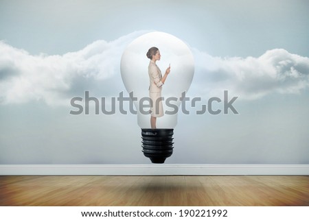 Thinking businesswoman in light bulb against clouds in a room
