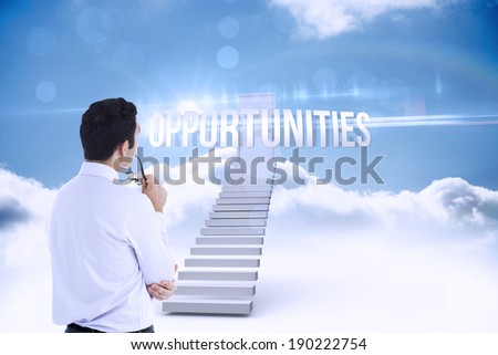 The word opportunities and businessman holding glasses against shut door at top of stairs in the sky