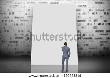 Composite image of thinking businessman against white card