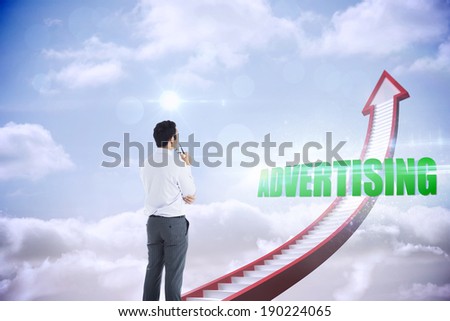The word advertising and businessman holding glasses against red stairs arrow pointing up against sky
