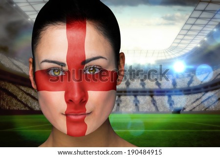 Composite image of beautiful england fan in face paint against vast football stadium with fans in white