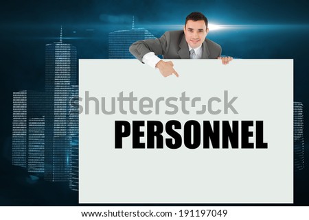 Businessman showing card saying personnel against digital background