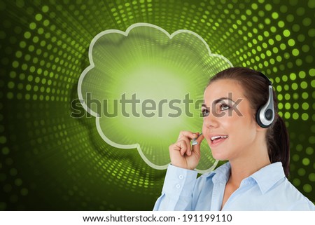 Composite image of cloud and call centre worker against green pixel spiral