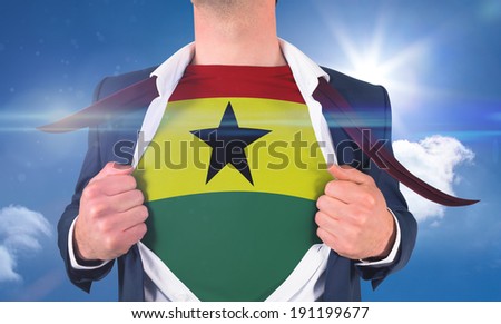 Businessman opening shirt to reveal ghana flag against bright blue sky with clouds