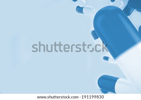 Digitally generated blue medical background with pills