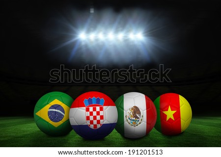 Group a world cup footballs under spotlight on football pitch