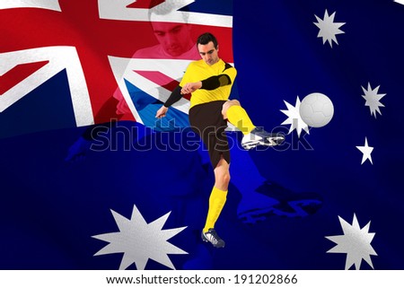 Football player in yellow kicking against digitally generated australian national flag