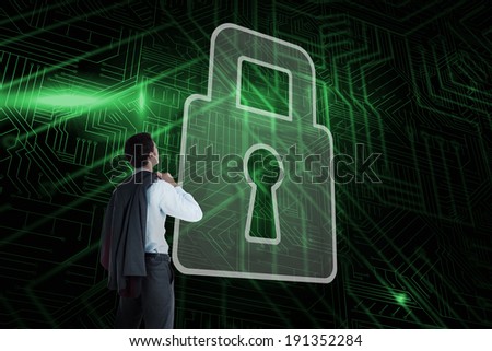 Composite image of lock and businessman looking against green and black circuit board