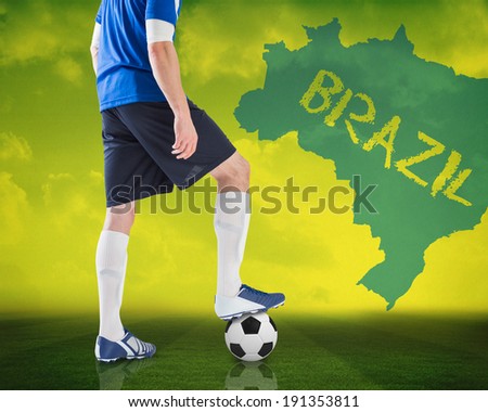 Composite image of football player standing with ball against football pitch with brazil outline and text