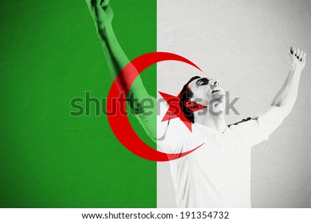 Excited football fan cheering against algeria national flag