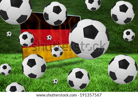 Black and white footballs against germany flag in grunge effect