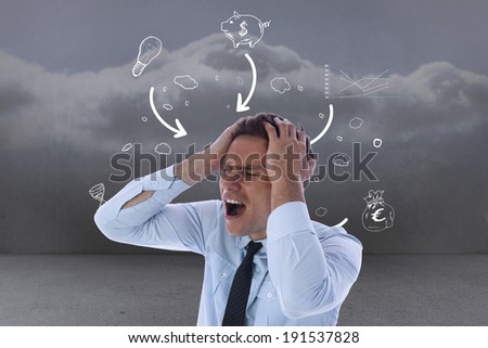 Stressed businessman with hands on head against clouds in a room