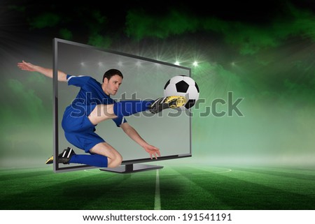 Composite image of fit football player kicking ball through tv against football pitch under green sky