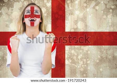 Excited fan england in face paint cheering against england flag in grunge effect