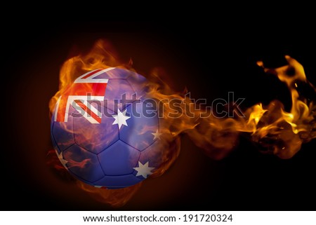 Composite image of fire surrounding australia ball against black