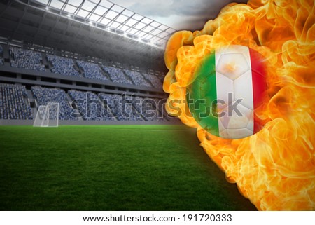 Composite image of fire surrounding italy flag football against vast football stadium with fans in blue