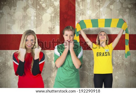 Composite image of various football fans against england flag in grunge effect