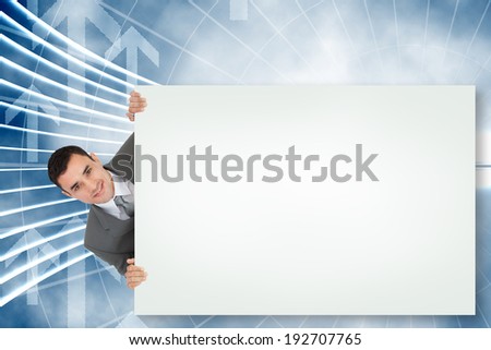 Composite image of businessman showing white card