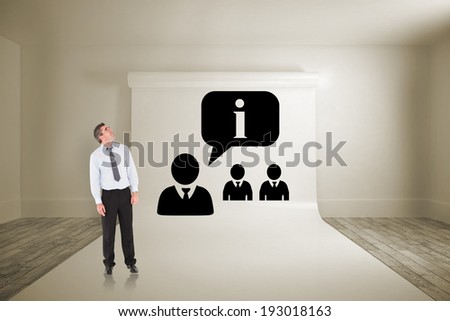 Businessman looking up against large white screen showing graphic