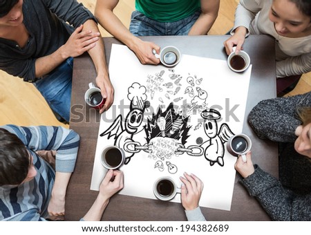 People sitting around table drinking coffee with page showing angel and devil doodle