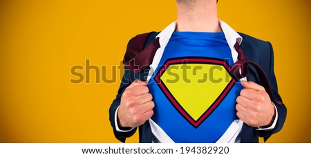 Businessman opening shirt in superhero style against yellow background with vignette