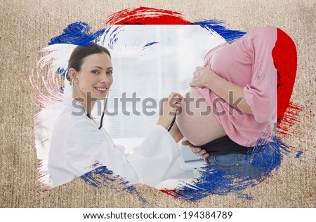 Composite image of pregnant woman at check up with doctor with black red and blue paint against weathered surface