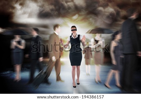 Redhead businesswoman in a blindfold against stormy sky with tornado over road