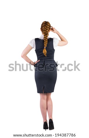 Redhead businesswoman scratching her head on white background