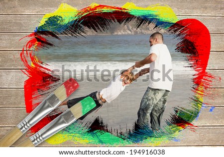 Composite image of father and son on the beach against wooden surface with paintbrushes
