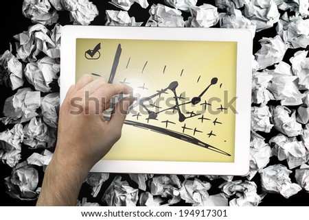 Composite image of hand touching tablet showing data analysis doodle
