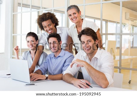 Business people using laptop smile to camera in the office