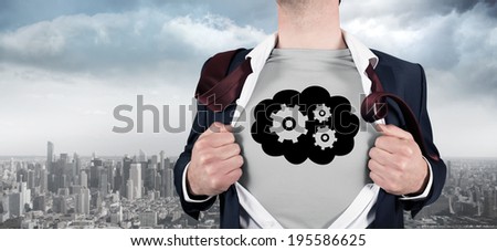 Businessman opening shirt in superhero style against balcony overlooking city