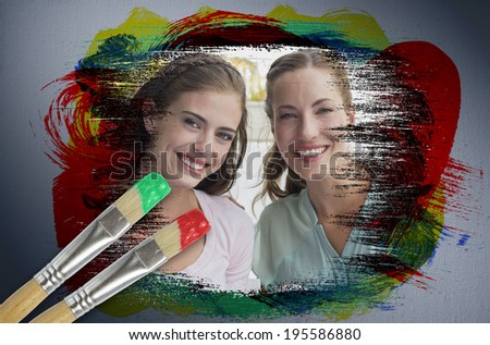 Composite image of friends smiling at camera with paintbrush dipped in red against digitally generated grey vignette background