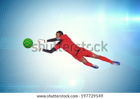 Goalkeeper in red making a save against technical screen with pixels